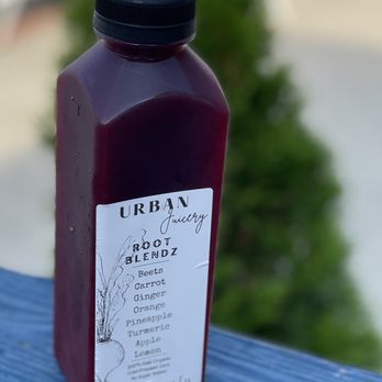 Urban Juicery - a bottle of juice sitting on a bench - Juice Bars & Smoothies Near Me - New York, New York Urban Juicery - a bottle of juice sitting on a bench - Juice Bars & Smoothies Near Me - New York, New York