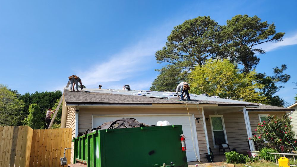 Slide of JS Roofing Group