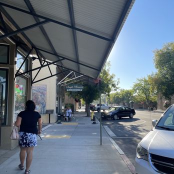 Simple Pleasures Restaurant - a woman walking down the sidewalk - Breakfast & Brunch Near Me - Lincoln, California