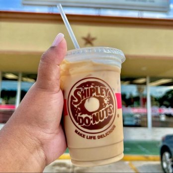 Shipley Do-Nuts - a hand holding a cup of coffee - Donuts Near Me - Mont Belvieu, Texas Shipley Do-Nuts - a hand holding a cup of coffee - Donuts Near Me - Mont Belvieu, Texas