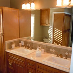 Inspired Creations - Cinnamon cabinets with soft close features and Crema Marfil marble top.