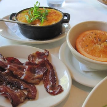 Perla's - Lambert's Bacon, Lobster Stock, Cheddar, & Green Onion Grits, and Old School Baked Grapefruit. - Seafood Near Me - Austin, Texas Perla's - Lambert's Bacon, Lobster Stock, Cheddar, & Green Onion Grits, and Old School Baked Grapefruit. - Seafood Near Me - Austin, Texas