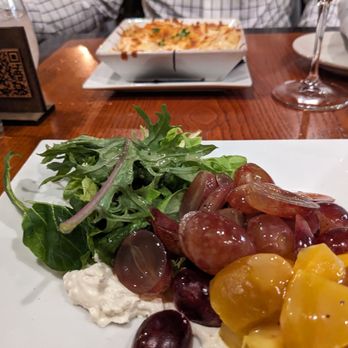 Pairings Bistro - Golden beet salad with goat cheese in front, lobster Mac and cheese back - Tapas Bars Near Me - Bel Air, Maryland