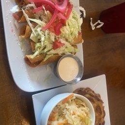 (LEFT) Hondurian Tacos (RIGHT) pupusa revuelta (LEFT) Hondurian Tacos (RIGHT) pupusa revuelta