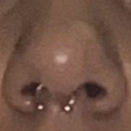Crooked septum piercing. This place doesn't know how to do piercings.