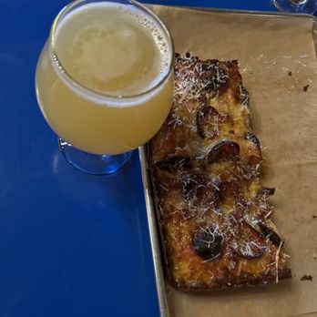 Rising Storm Brewing - The Mill - One of their IPAs with their Detroit style pizza - Breweries Near Me - Rochester, New York Rising Storm Brewing - The Mill - One of their IPAs with their Detroit style pizza - Breweries Near Me - Rochester, New York