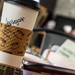 Cascades Coffee House - Hot beverage cup on small table