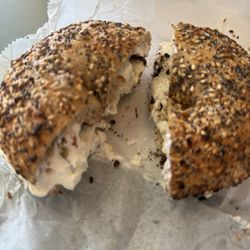 Signature Bagels Deli & Catering - Whole Wheat Everything Bagel with olive cream