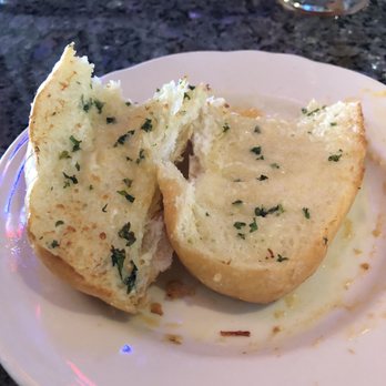 Pappadeaux Seafood Kitchen - Garlic Bread served with the Shrimp & Crawfish Fondeaux - Seafood Near Me - Bedford, Texas