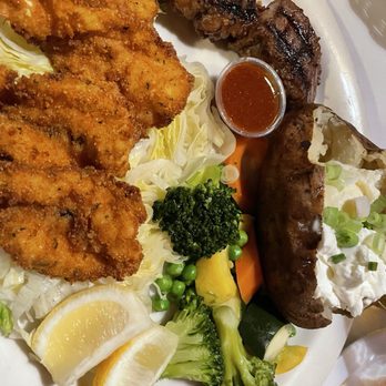 Safari Room - Surf and turf special. Fried shrimp and baked potato - Steakhouses Near Me - Mission Hills, California