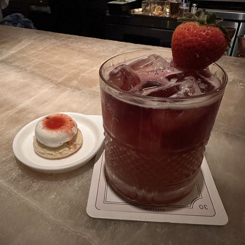 Bandista - Strawberry Fields accompanied by a Lemon Cookie w/ a Goat Cheese and Peppercorn Donut and a Strawberry Syrup Drizzle - Cocktail Bars Near Me - Houston, Texas