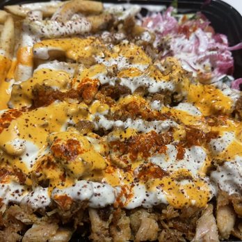 Shawarma Bay - a tray of fries covered in cheese - Middle Eastern Near Me - New York, New York Shawarma Bay - a tray of fries covered in cheese - Middle Eastern Near Me - New York, New York