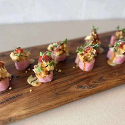 Rice Bowl Sushi - "Kiss Roll" Spicy Tuna, Avocado, Wrapped in Soy Papper, topped with Crispy Escolar, Chef's Special Sauce and Tobiko.
