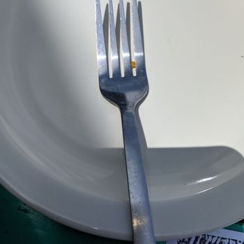 Laguna BoB - Food stuck on my fork from a previous diner - American Near Me - South Padre Island, Texas