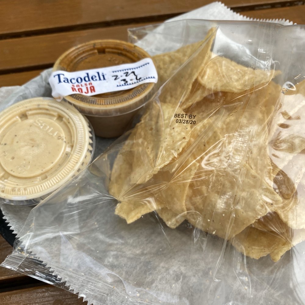 Tacodeli - Chips and queso, plus a side of red salsa - Breakfast & Brunch Near Me - Austin, Texas Tacodeli - Chips and queso, plus a side of red salsa - Breakfast & Brunch Near Me - Austin, Texas