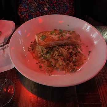 Pierson's Grille & Spirits - Exceptional salmon dinner with the most amazing rice.  The pink cast is from the lighting. - American Near Me - Harbor Springs, Michigan