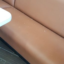  a dirty couch and table