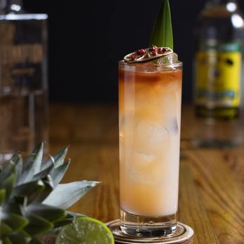 Iron Oak Post - a pineapple cocktail with a pineapple garnish - Bars Near Me - Melbourne, Florida Iron Oak Post - a pineapple cocktail with a pineapple garnish - Bars Near Me - Melbourne, Florida