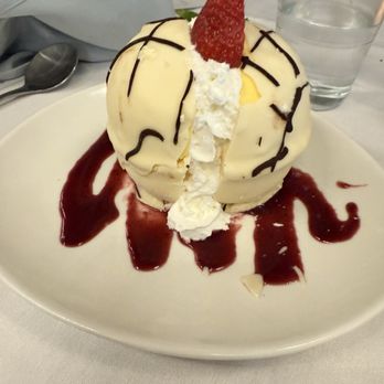 Arcos Cucina + Bar - Passion fruit Mango sorbet in a white chocolate shell - Italian Near Me - Hopkinton, Massachusetts Arcos Cucina + Bar - Passion fruit Mango sorbet in a white chocolate shell - Italian Near Me - Hopkinton, Massachusetts