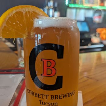 Corbett Brewery - a pint of beer with a slice of orange - Breweries Near Me - Tucson, Arizona
