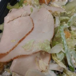 a closeup of a salad with chicken and lettuce a closeup of a salad with chicken and lettuce