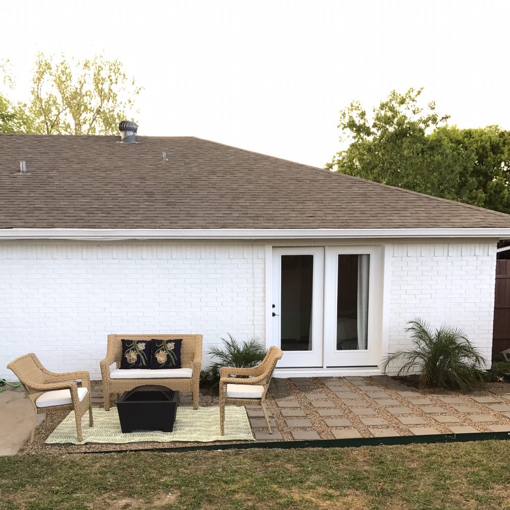 Lone Star Remodeling - 'After' back patio with new door instead of window and painted brick w/ some landscaping - General Contractors Near Me - Rowlett, Texas Lone Star Remodeling - 'After' back patio with new door instead of window and painted brick w/ some landscaping - General Contractors Near Me - Rowlett, Texas