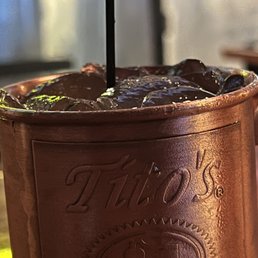 a chocolate drink in a copper cup a chocolate drink in a copper cup