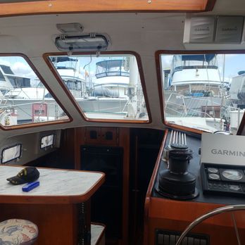 Niza Marine - Luis made wood trim on the windshields with new vinyl.  Upper right Luis built a beautiful enclosed mount for the VHS radio - Boat Repair Near Me - Ensenada, BCN
