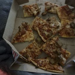 Domino's Pizza - My pizza got here like this I am so mad this should not have off happened there are 4 pieces of pizza missing. You guys should be ashamed.