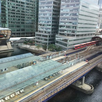 Canary Wharf - View of the DLR light rail station from the Marriott hotel (mesmerizing to watch the activity) - Landmarks & Historical Buildings Near Me - London, XGL