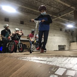 At top of ramp with scooter At top of ramp with scooter
