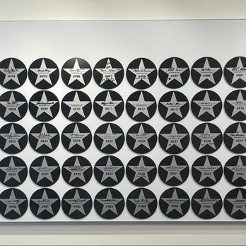 Porsche Experience Center Los Angeles - Display wall of plaques from delivery customers. - Racing Experience Near Me - Carson, California Porsche Experience Center Los Angeles - Display wall of plaques from delivery customers. - Racing Experience Near Me - Carson, California