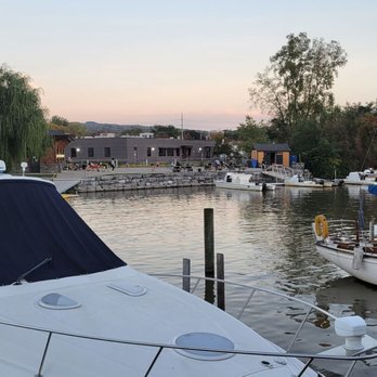 The BoatYard Grill - outdoor dining on Cayuga lake across from the crew team boathouses. - Seafood Near Me - Ithaca, New York The BoatYard Grill - outdoor dining on Cayuga lake across from the crew team boathouses. - Seafood Near Me - Ithaca, New York