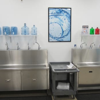 H2O To Go - Water Store - a stainless steel sink and several bottles - Water Stores Near Me - Tracy, California