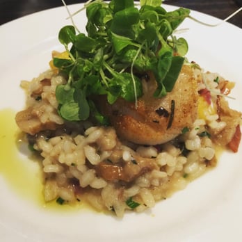 Panzano - Capesante: Pan-seared scallop over Palisade peach and porcini risotto, smoked speck, drizzled with white truffle vinaigrette. - Italian Near Me - Denver, Colorado Panzano - Capesante: Pan-seared scallop over Palisade peach and porcini risotto, smoked speck, drizzled with white truffle vinaigrette. - Italian Near Me - Denver, Colorado