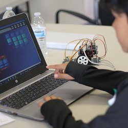 MaKaboom - Uploading his codes to the robot.