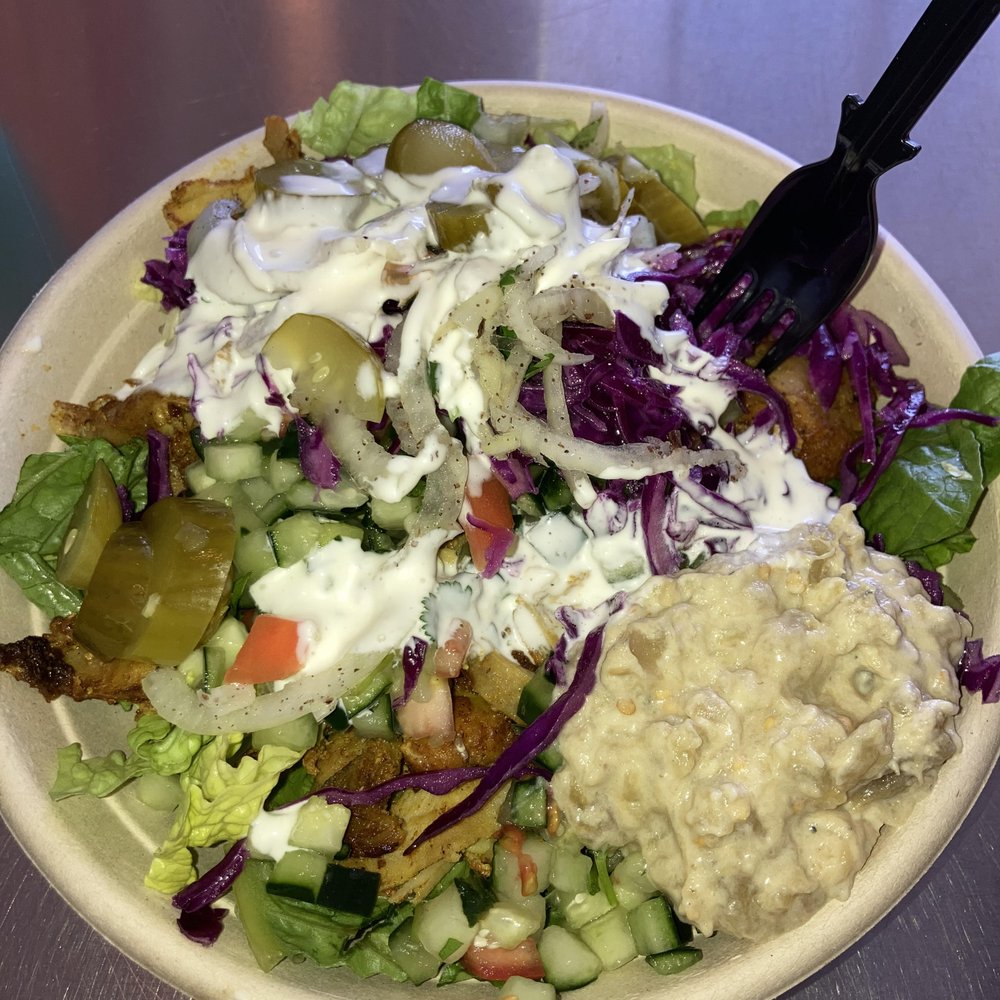 Chicken Shawarma Salad with cabbage, onion, pickles, garlic, baba ganoush, cucumber and tomato Chicken Shawarma Salad with cabbage, onion, pickles, garlic, baba ganoush, cucumber and tomato