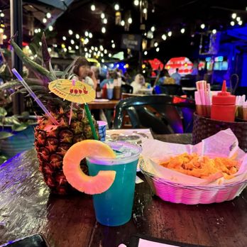 Cuckoo Coconuts Waikiki - Cheese fries blue Hawaiian and pina colada - Cocktail Bars Near Me - Honolulu, Hawaii