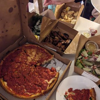 Little Star Pizza - Spicy sausage deep dish pizza, wings, roasted broccolini, roasted caulfilower, Greek salad - Pizza Near Me - San Francisco, California