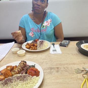 Mediterranean Island - Me with my husband enjoying a Chicken Kabab Plate with some Pita bread, Hummus and the delicious infamous Garlic Paste... - Mediterranean Near Me - Victorville, California