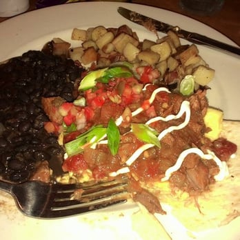 Wild Eggs - *Chili Verde Huevos Rancheros~Two eggs any style with green chili, black beans, skillet potatoes, sour cream, pico de gallo, green onion and - Breakfast & Brunch Near Me - Lexington, Kentucky