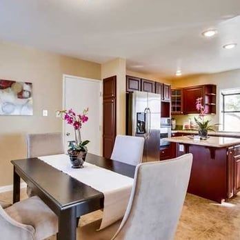 Hawkeye Remodeling and Design - a kitchen with a dining table and chairs - General Contractors Near Me - Oceanside, California Hawkeye Remodeling and Design - a kitchen with a dining table and chairs - General Contractors Near Me - Oceanside, California