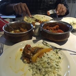 Excellent chicken aam achari(left) and lamb roghan ghosh with buttery garlic rice. Excellent chicken aam achari(left) and lamb roghan ghosh with buttery garlic rice.