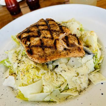 Southern Tide - Caesar salad topped with grilled salmon. - Southern Near Me - Sea Island, Georgia Southern Tide - Caesar salad topped with grilled salmon. - Southern Near Me - Sea Island, Georgia
