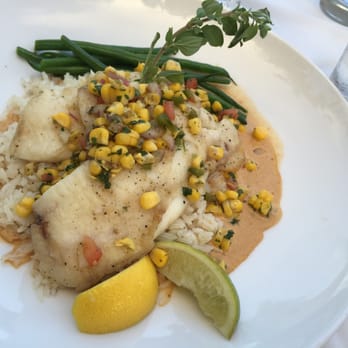 Louie's Backyard - Fresh catch: hogfish with lobster sauce over rice - New American Near Me - Key West, Florida Louie's Backyard - Fresh catch: hogfish with lobster sauce over rice - New American Near Me - Key West, Florida
