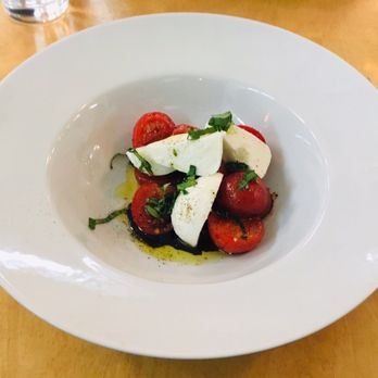 Magnolia - a plate of food with tomatoes and mozzarella - French Near Me - Montreal, Quebec Magnolia - a plate of food with tomatoes and mozzarella - French Near Me - Montreal, Quebec