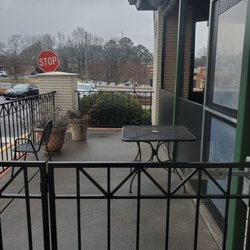 Papi's Cuban & Caribbean Grill - Sidewalk view looking onto Duluth Hwy