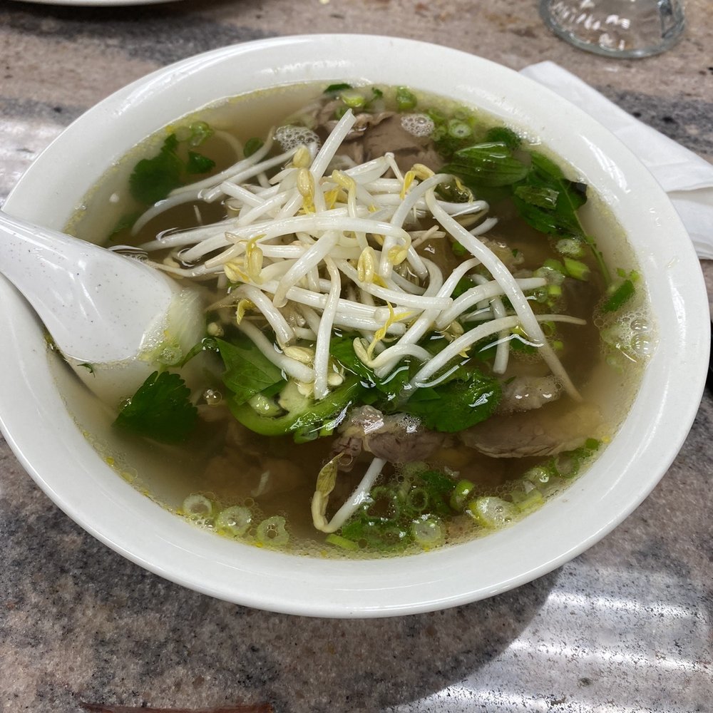 a bowl of soup with a spoon a bowl of soup with a spoon