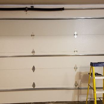 GK1 Garage Doors - Putting the Springs on a New garage door. - Garage Door Services Near Me