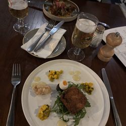 Eagle & Child - Pork fritter with black pudding, quail's egg and piccalilli (front), onion bhajis (rear).